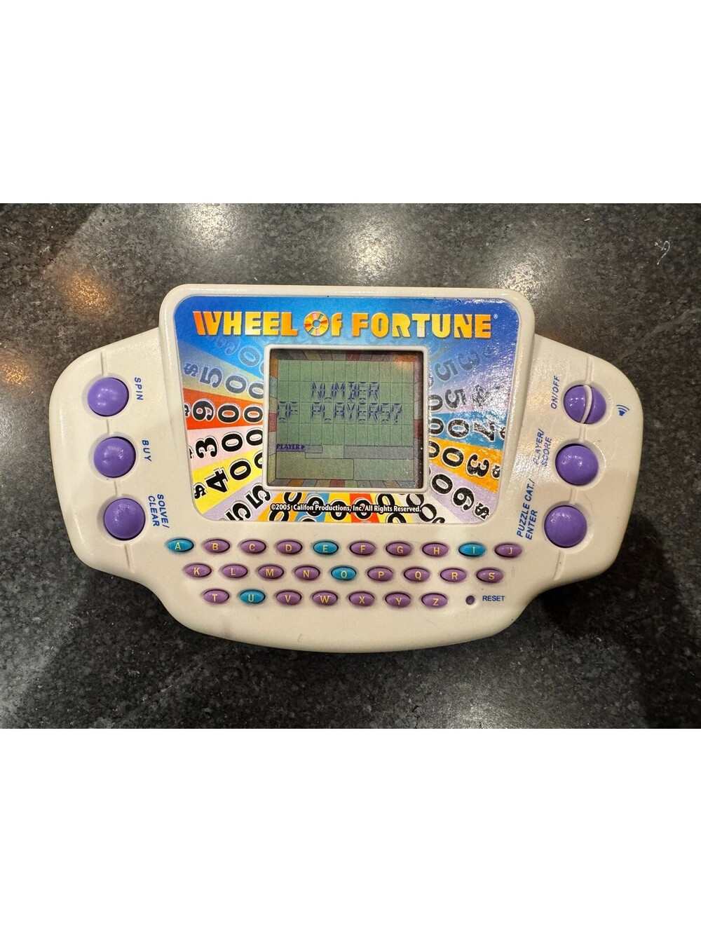 Vintage Wheel of Fortune Handheld Electronic Game (2005)